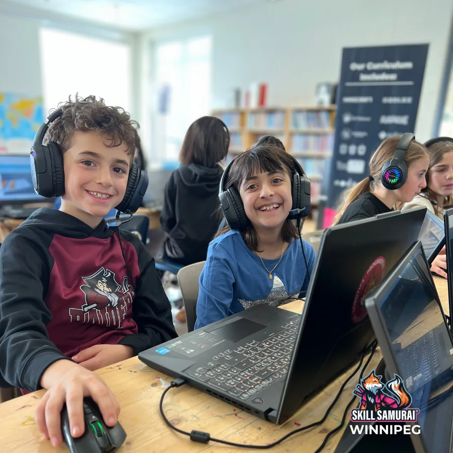 Children using headphones and laptops in class